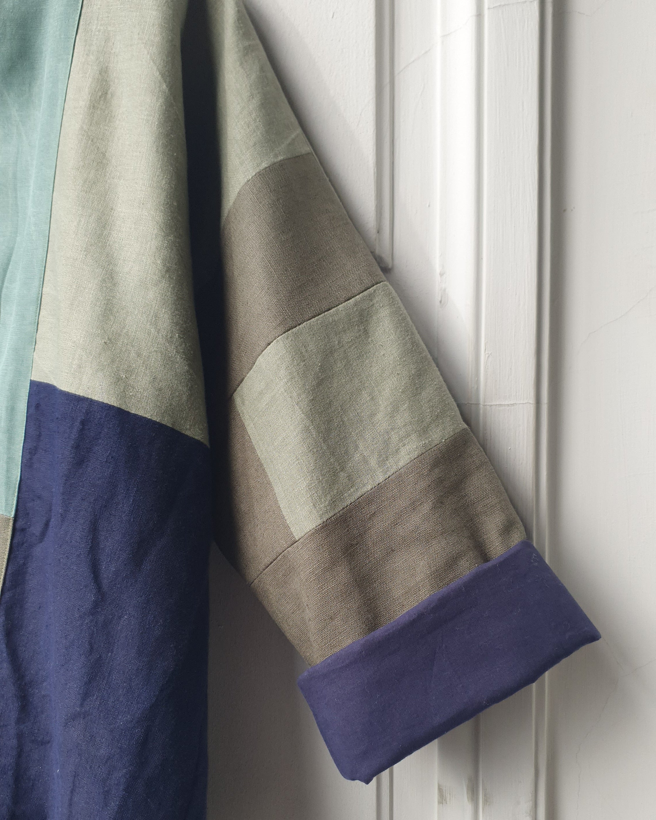 Unique handcrafted patchwork Haori Kimono jacket in cotton, in colors blue and green and turquoise. Atelier Heimat patchwork, made by Kachiri Faes.