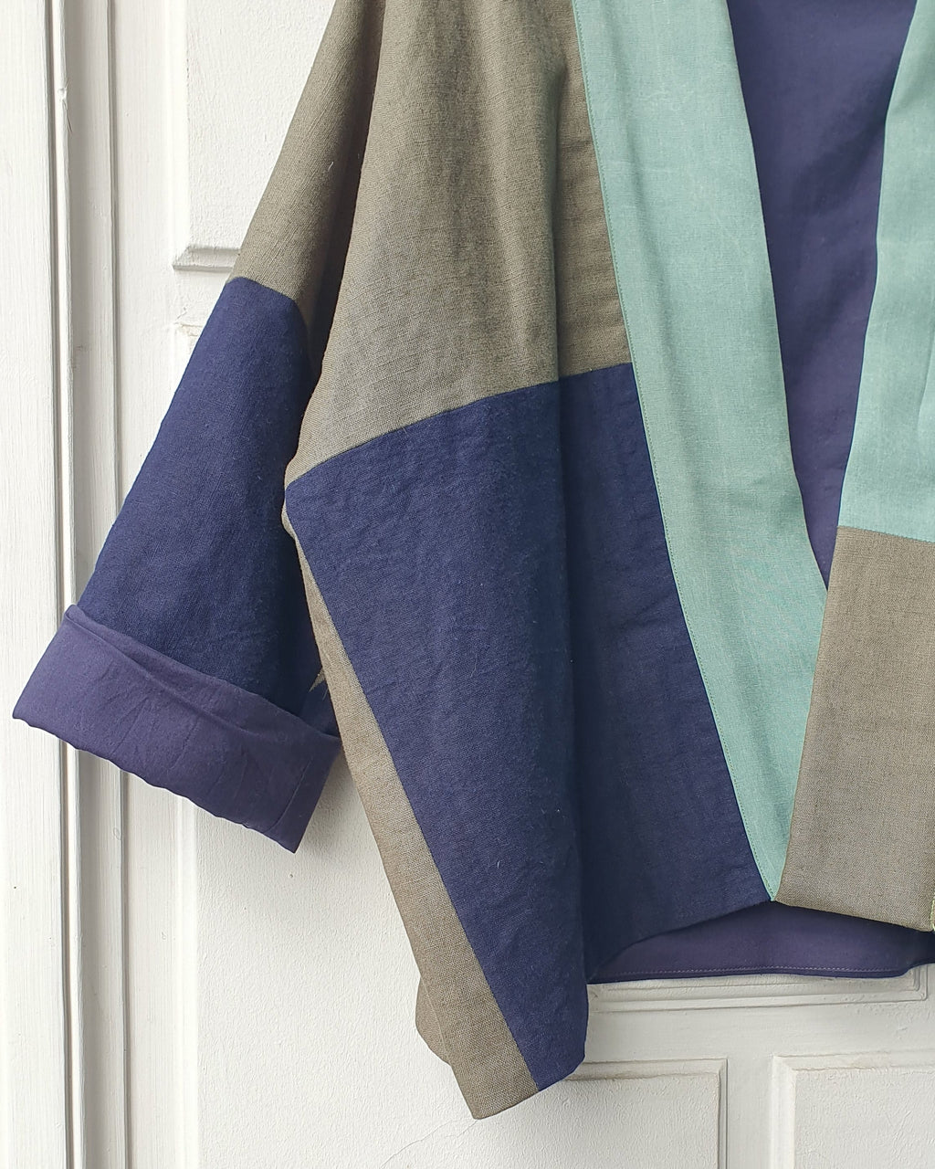Unique handcrafted patchwork Haori Kimono jacket in cotton, in colors blue and green and turquoise. Atelier Heimat patchwork, made by Kachiri Faes.