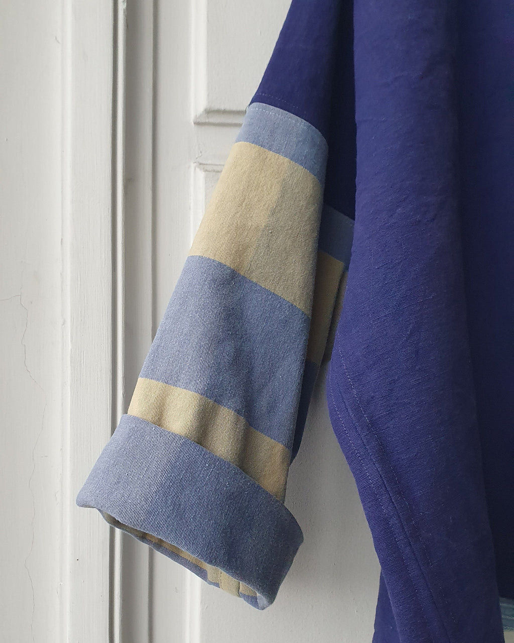 Unique handcrafted patchwork Haori Kimono jacket in cotton, in colors blue and green checks. details of the sleeve. Made by Atelier Heimat, handcrafted by Kachiri Faes